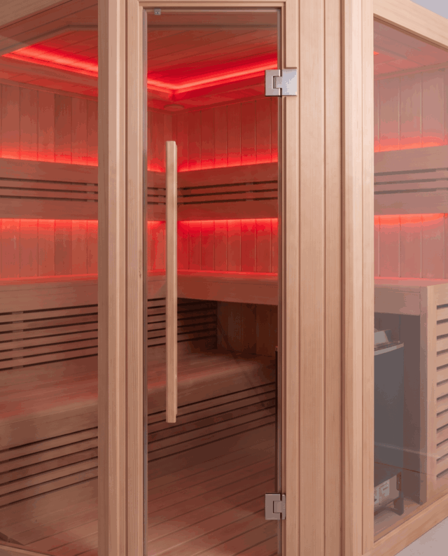 Glass sauna doors with timber handle, red interior lighting glowing through from inside